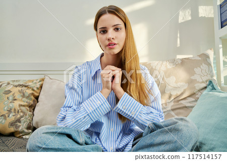 Webcam portrait young woman teenager looking talking listening to camera, at home 117514157
