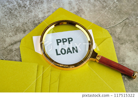 Paycheck Protection Program PPP Loan written in a letter sticking out of a mustard-colored envelope Paycheck Protection Program PPP Loan written in a letter sticking out of a mustard-colored envelope 117515322