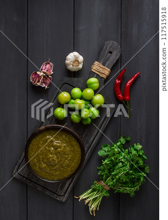 Tkemali sauce, traditional Georgian cuisine, green cherry plum, on a wooden table, close-up, rustic, food background, no people, selective focus, Tkemali sauce, traditional Georgian cuisine, green cherry plum, on a wooden table, close-up, rustic, food background, no people, selective focus, 117515918