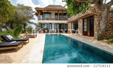 Luxury beach villa with modern swimming pool in tropical resort. Nobody inside 117516112