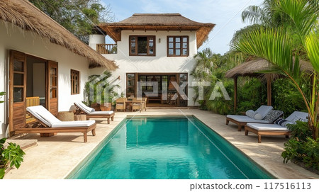 Luxury beach villa with modern swimming pool in tropical resort. Nobody inside 117516113