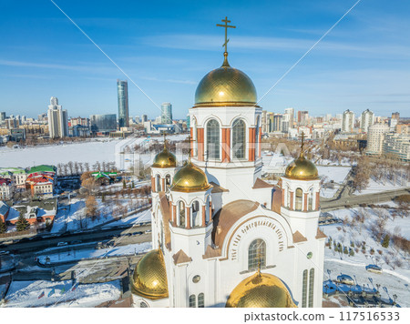Winter Yekaterinburg and Temple on Blood in beautiful cloudy sunset. Aerial view of Yekaterinburg, Russia. Translation of the text on the temple Winter Yekaterinburg and Temple on Blood in beautiful cloudy sunset. Aerial view of Yekaterinburg, Russia. Translation of the text on the temple 117516533