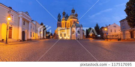 Cathedral of St. Peter and Paul in Poznan at dawn with Gothic towers in soft morning light. Cathedral of St. Peter and Paul in Poznan at dawn with Gothic towers in soft morning light. 117517095