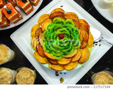 Fruit Cake with Peach and Kiwi Slices Fruit Cake with Peach and Kiwi Slices 117517104