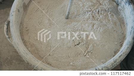 mixing concrete plaster with electric mixer mixing concrete plaster with electric mixer 117517462