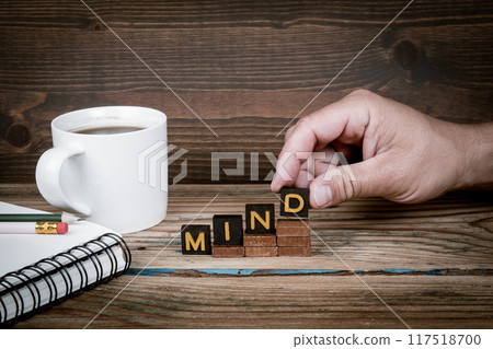 MIND. Old letter tiles on wooden steps, development concept MIND. Old letter tiles on wooden steps, development concept 117518700