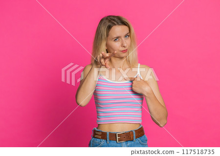 Young woman pointing at eyes and camera show I am watching you gesture spying, watching on someone Young woman pointing at eyes and camera show I am watching you gesture spying, watching on someone 117518735