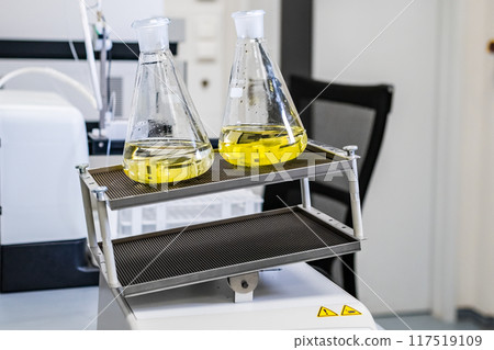 Samples shaking on the laboratory shaker, preparing them for further analysis in the laboratory. Samples shaking on the laboratory shaker, preparing them for further analysis in the laboratory. 117519109