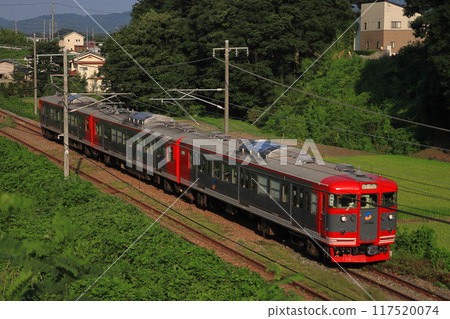 Shinano Railway 115 series train running through Karuizawa in the summer as the sunset shines_Photo taken on August 3, 2024 117520074
