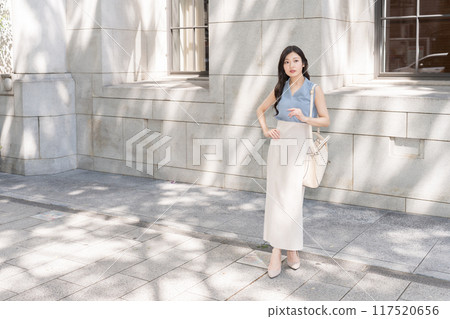 Business woman in an office district Business woman in an office district 117520656