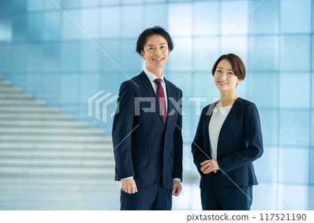 Male and female employees business image Male and female employees business image 117521190