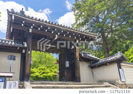 Summer in Iwakura, Kyoto: Jisso-in Temple, green leaves and the temple gate Summer in Iwakura, Kyoto: Jisso-in Temple, green leaves and the temple gate 117521310