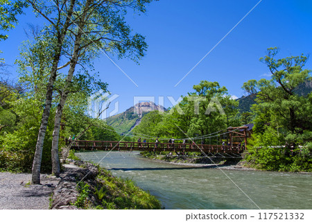 "Refreshing Kamikochi - A spectacular view in early summer" Kappa Bridge and Mount Yakedake with beautiful fresh greenery 117521332