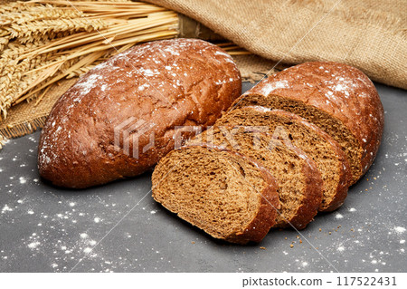 Freshly baked rye bread with a rustic crust, perfect for sandwiches or as a side Freshly baked rye bread with a rustic crust, perfect for sandwiches or as a side 117522431