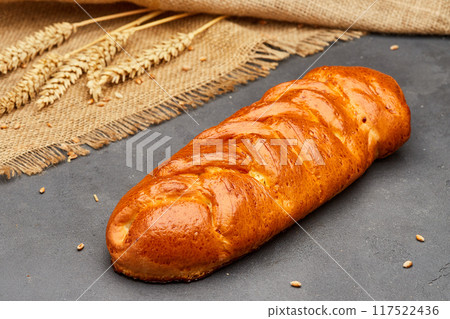 Tasty gluten-free white bread on dark stone surface Tasty gluten-free white bread on dark stone surface 117522436