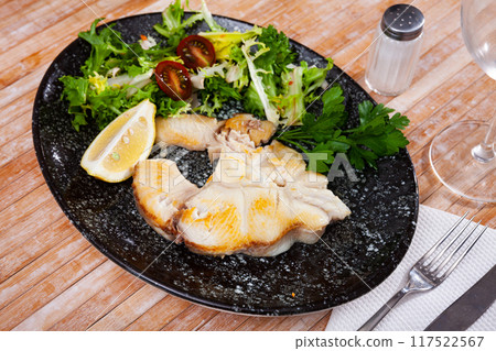 Delicious roasted tintorera blue shark served with fresh vegetables 117522567