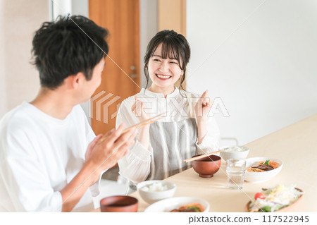 Couple complimenting wife after eating at home (delicious/self-cooked) Couple complimenting wife after eating at home (delicious/self-cooked) 117522945