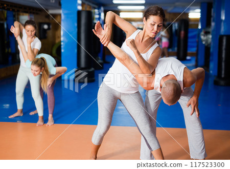 Woman exercising armlock 117523300