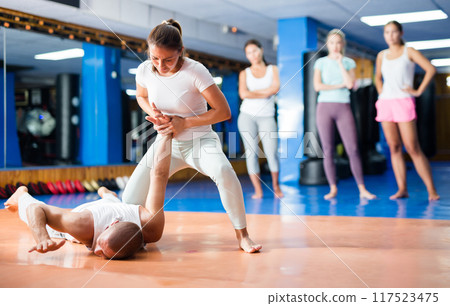Woman doing wristlock movement 117523475