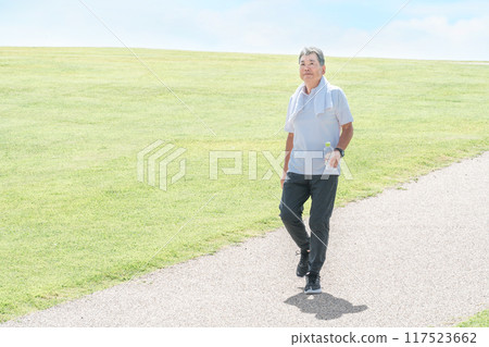 Elderly man walking and aerobic exercise in the park Elderly man walking and aerobic exercise in the park 117523662