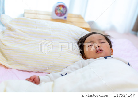 Close-up of a 2-year-old child sleeping Close-up of a 2-year-old child sleeping 117524147