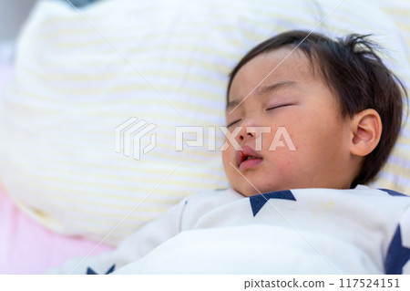 Close-up of a 2-year-old child sleeping Close-up of a 2-year-old child sleeping 117524151