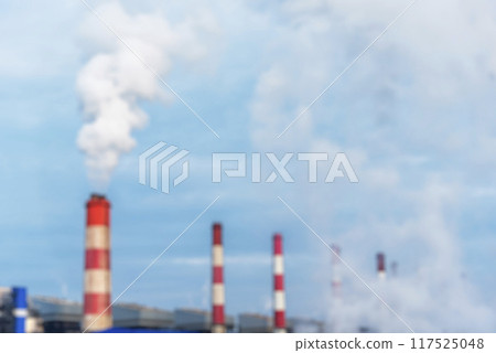Blurred background Power stations electrical industrial plant. Blurry Electric power building refinery engineering steam smokestack. Defocused Lignite electricity chimney release pollution background 117525048