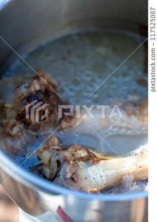 Raw meat dog food boiled in a pressure cooker - knuckles Raw meat dog food boiled in a pressure cooker - knuckles 117525087