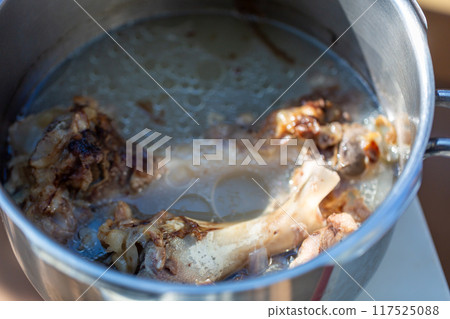 Raw meat dog food boiled in a pressure cooker - knuckles Raw meat dog food boiled in a pressure cooker - knuckles 117525088