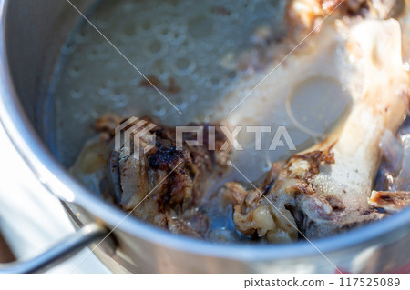 Raw meat dog food boiled in a pressure cooker - knuckles Raw meat dog food boiled in a pressure cooker - knuckles 117525089
