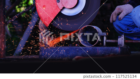Welding machinery iron metal sparking equipment. Hot flame welding metal work cutting fire iron workshop. Locksmith using Welding machine cutting metal process grinder. Heavy Engineer metalworking Welding machinery iron metal sparking equipment. Hot flame welding metal work cutting fire iron workshop. Locksmith using Welding machine cutting metal process grinder. Heavy Engineer metalworking 117525134