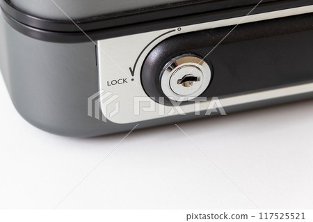 Close up on the keyhole of a safe 117525521