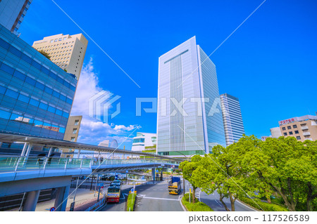 Yokohama cityscape in Japan: View of Yokohama City Hall and the Akaikutsu train from the front of Sakuragicho Station's New South Exit (August 17, 2024) 117526589