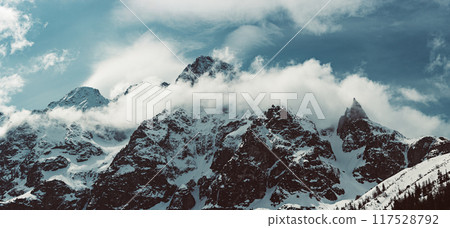 Mountain peaks near Morskie Oko or Sea Eye Lake in Poland at Winter. Tatras range Mountain peaks near Morskie Oko or Sea Eye Lake in Poland at Winter. Tatras range 117528792