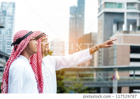 Arab muslim men talking together team uae union teamwork people. Digital marketing arab group of people discuss consulting modern muslim UAE city. Happy Entrepreneur Asian people smile teams meeting Arab muslim men talking together team uae union teamwork people. Digital marketing arab group of people discuss consulting modern muslim UAE city. Happy Entrepreneur Asian people smile teams meeting 117529787