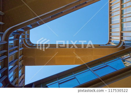 Geometric composition with architectural elements. Exterior of modern building against blue sky. Minimalistic street architecture 117530522