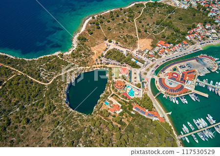Aerial view of Dragon Eye lake near Marina Frapa in Rogoznica, Croatia. Sea landscape with coastal town and yachts. Touristic city for summer vacation in Adriatic sea Aerial view of Dragon Eye lake near Marina Frapa in Rogoznica, Croatia. Sea landscape with coastal town and yachts. Touristic city for summer vacation in Adriatic sea 117530529