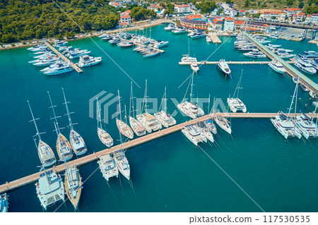 Luxury yachts and sailboats are docking in marina Frapa in Rogoznica town, Croatia on sunny summer day. Touristic city for summer vacation in Adriatic sea, Dalmatia region. Summer vacation concept Luxury yachts and sailboats are docking in marina Frapa in Rogoznica town, Croatia on sunny summer day. Touristic city for summer vacation in Adriatic sea, Dalmatia region. Summer vacation concept 117530535