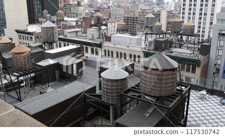 New York City Manhattan cityscape. Rooftop water towers, residential district buildings roof tanks. 117530742