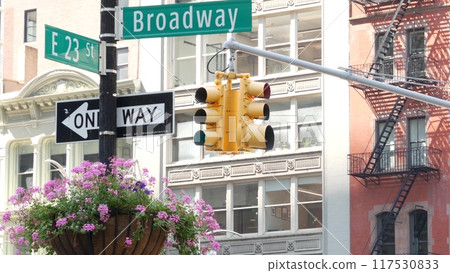 Broadway street road sign, Manhattan midtown architecture, New York City. Traffic signage of 23 st. Broadway street road sign, Manhattan midtown architecture, New York City. Traffic signage of 23 st. 117530833