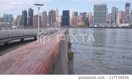 New York City waterfront skyline, Manhattan Midtown riverfront skyscrapers. Cityscape from Queens. 117530856