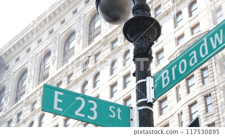 Broadway street road sign, Manhattan architecture, New York City. Traffic signage of 23 street. 117530895
