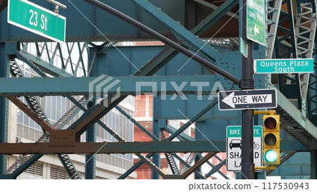 New York elevated subway, metropolitan bridge, metro track above street. Railway transport over road New York elevated subway, metropolitan bridge, metro track above street. Railway transport over road 117530943