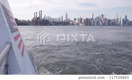 New York City skyline from ferry boat. Manhattan midtown, Empire State, Chrysler Building, USA. 117530993