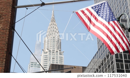 New York, american flag waving. Chrysler building. Manhattan midtown city street banner, patriotism. New York, american flag waving. Chrysler building. Manhattan midtown city street banner, patriotism. 117531040