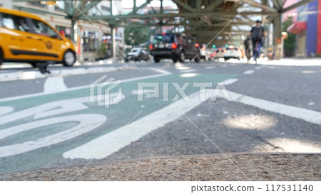 Elevated subway above New York street. Metropolitan bridge over road, Queens. Long Island taxi cab. Elevated subway above New York street. Metropolitan bridge over road, Queens. Long Island taxi cab. 117531140