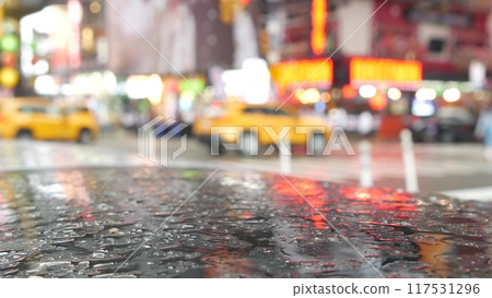 New York City Times Square, Manhattan Midtown Broadway street, USA. Wet road on rainy day, traffic. New York City Times Square, Manhattan Midtown Broadway street, USA. Wet road on rainy day, traffic. 117531296