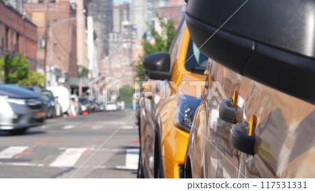 New York City. Row of yellow Taxi cars on street, Queens. Taxi cabs, Long Island. Medallion taxicab. New York City. Row of yellow Taxi cars on street, Queens. Taxi cabs, Long Island. Medallion taxicab. 117531331