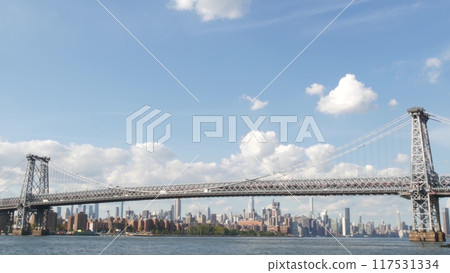 New York City skyline from ferry boat. Manhattan midtown, East river, Williamsburg Bridge, USA. 117531334