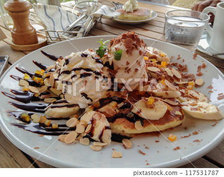 Delicious pancakes with bananas Delicious pancakes with bananas 117531787